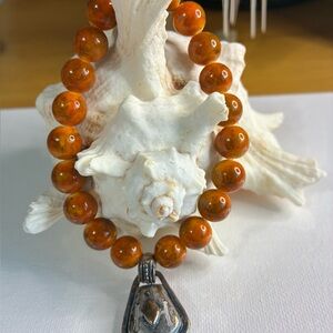 Vibrant Orange Beaded Bracelet with Silver Charm